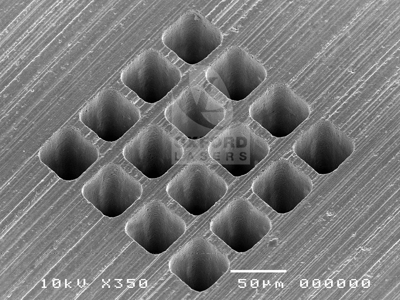 Laser microdrilling of square channels